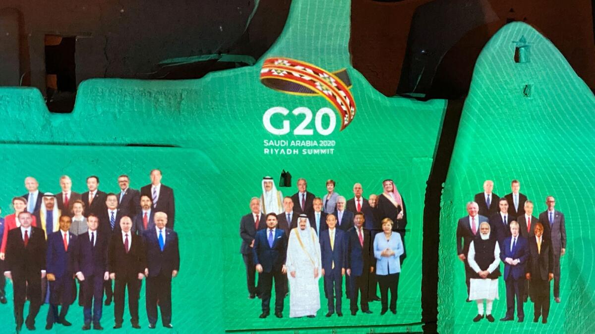 'Family Photo' for annual G20 Summit World Leaders is projected onto Salwa Palace in At Turaif, in Diriyah, Saudi Arabia, November 20, 2020.