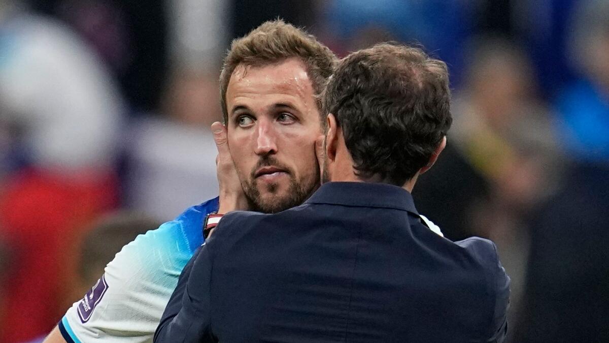 England's Harry Kane is comforted by head coach Gareth Southgate after losing 2-1 against France in the World Cup quarter-final. — AP