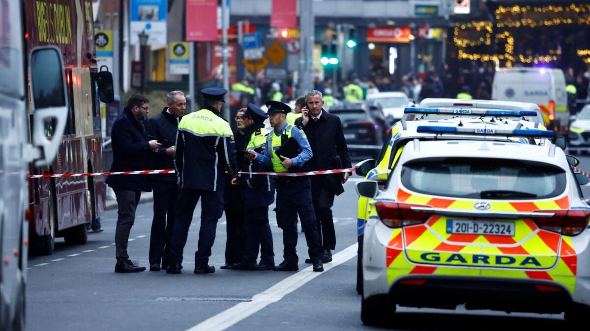 Police officers work at the scene of a suspected stabbing in Dublin, Ireland on Thursday. — Reuters