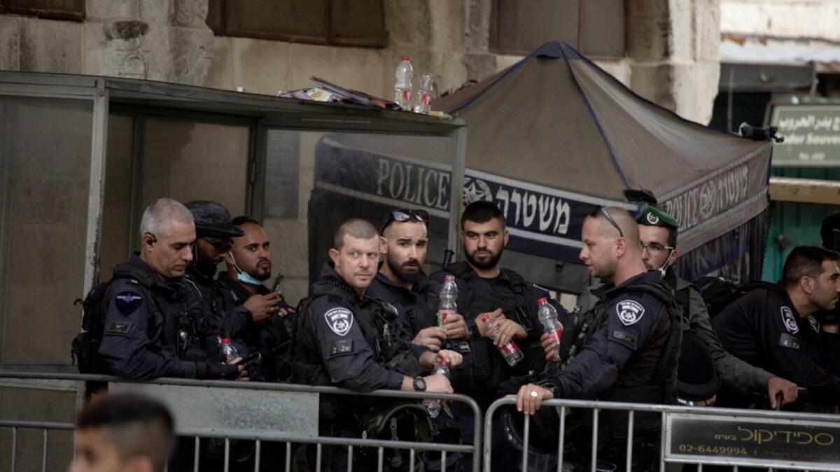 Israeli police stand guard at a checkpoint in the Old City of Jerusalem. — AP