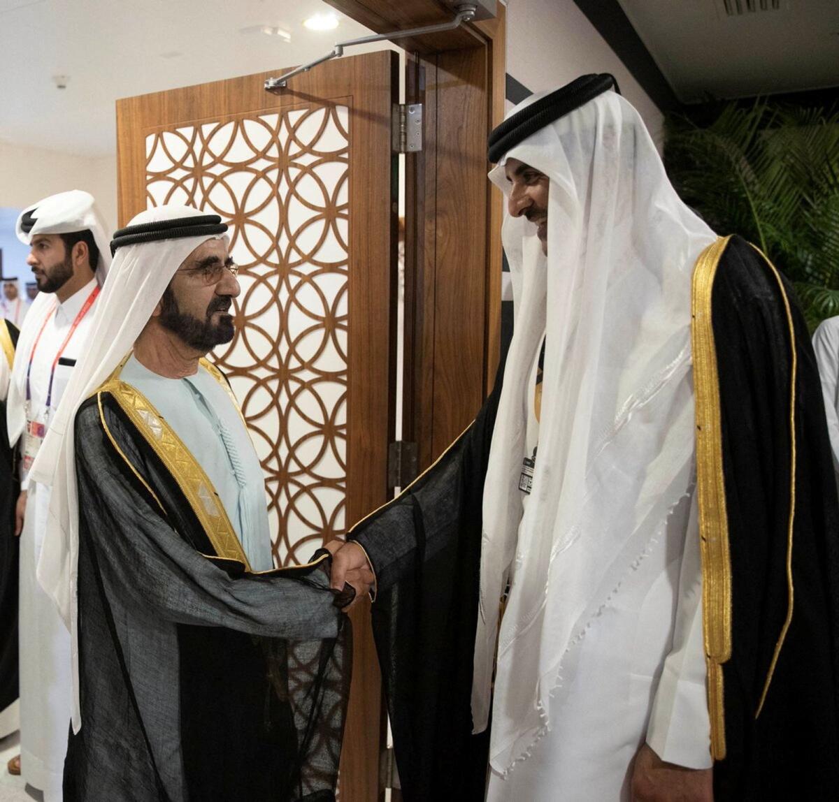 His Highness Sheikh Mohammed bin Rashid Al Maktoum, the Vice-President and Prime Minister of the UAE and Ruler of Dubai, shakes hands with Qatari Emir Sheikh Tamim bin Hamad al-Thani on the sidelines of the World Cup. Photo: Qatar News Agency
