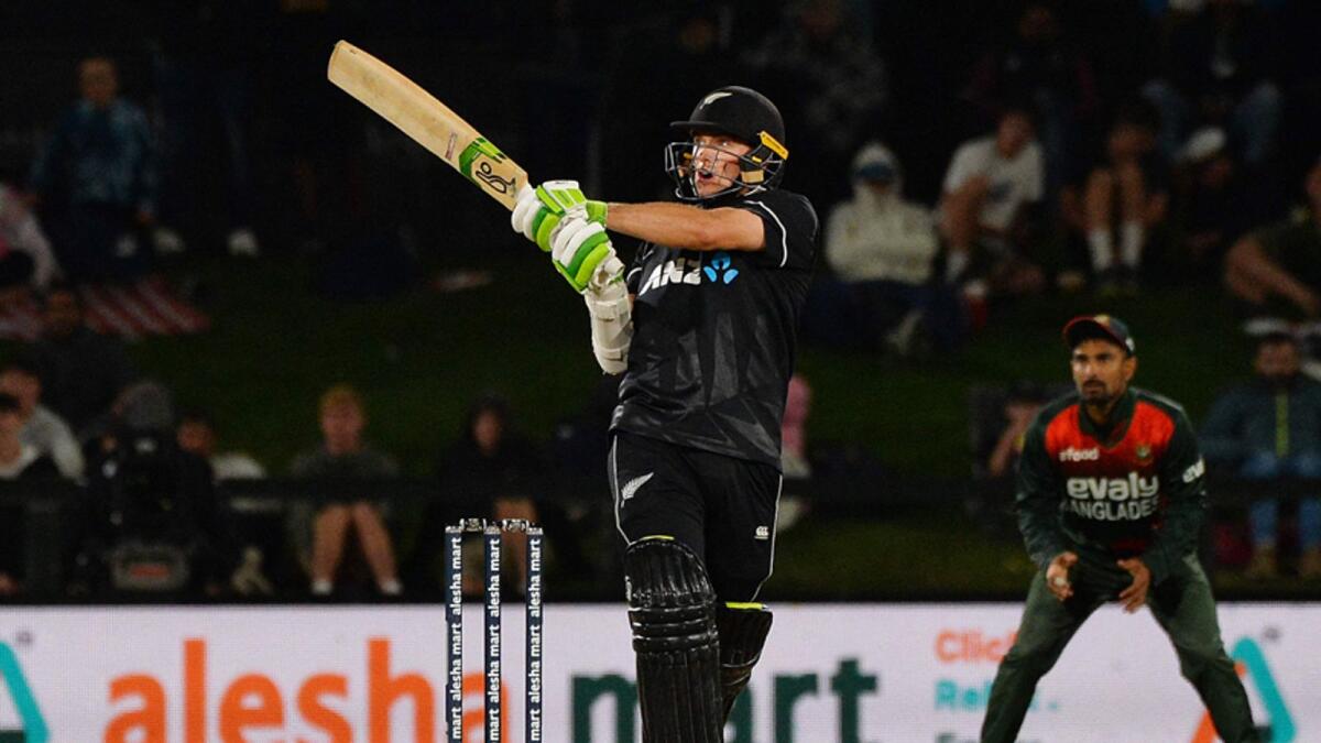 New Zealand's Tom Latham (L) plays a shot during the second one-day international (ODI) cricket match between New Zealand and Bangladesh at the Hagley Oval in Christchurch on March 23, 2021.  / AFP / SANKA VIDANAGAMA