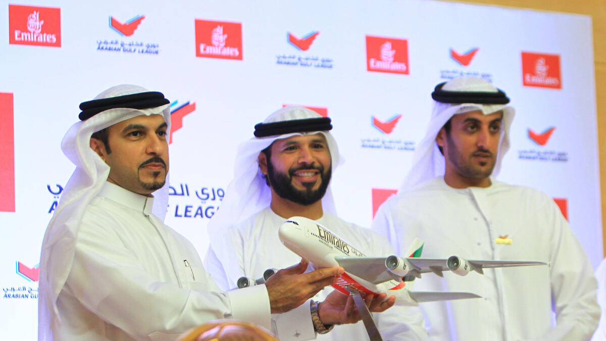 Shaikh Majid Al Mualla, divisional senior vice president, Commercial Operations of Emirates; Marwan bin Ghalita (centre) of Real Estate Regulatory Agency and Suhail Al Areefi, CEO of Pro League Committee, at the signing ceremony of the new sponsorship at 