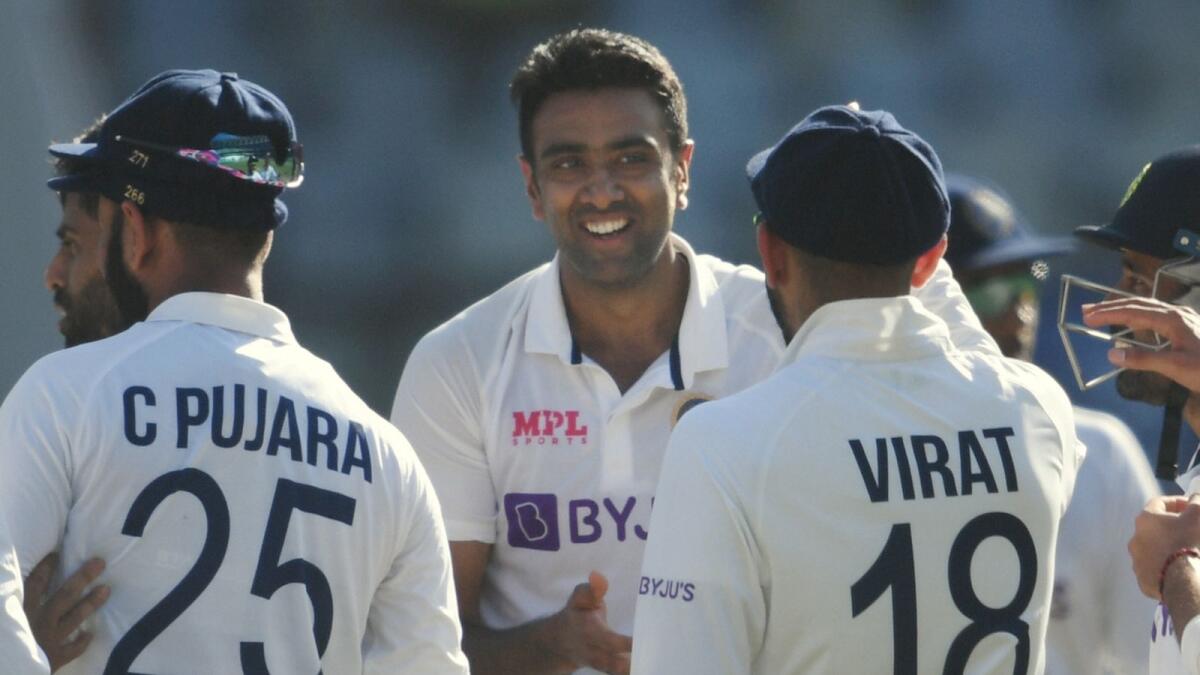 India's R Ashwin celebrates with teammates after taking the wicket of New Zealand batsman Ross Taylor. (PTI)