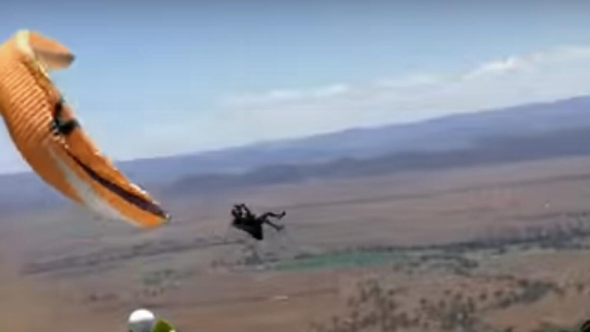 Video: Terrifying moment paraglider thrown sidewise by dust storm 