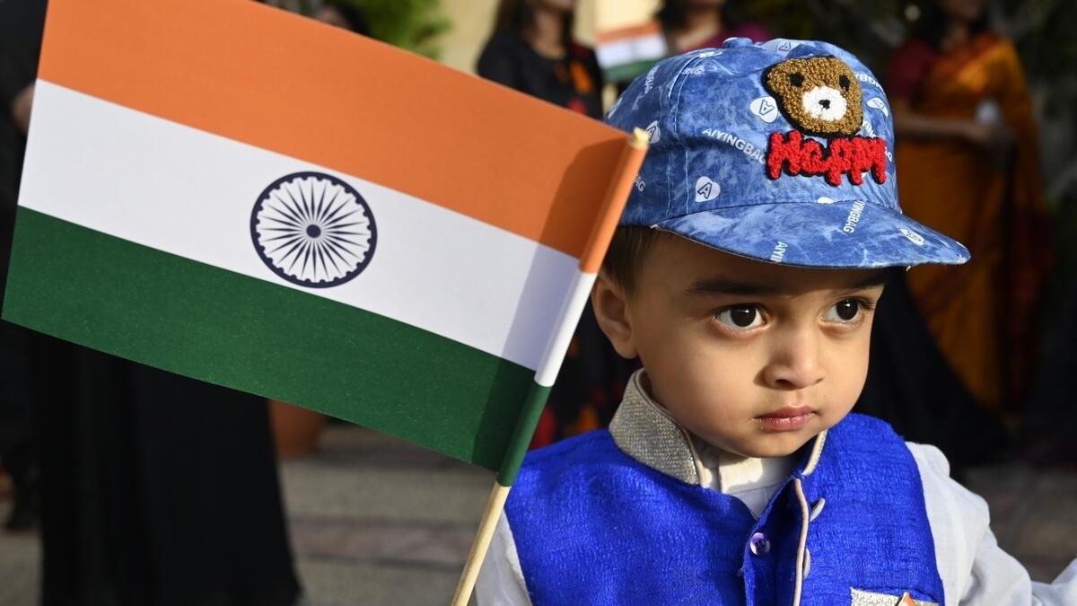 A child holds a flag in celebration of India's 71st Republic Day held at the Embassy in Abu Dhabi on January 26.