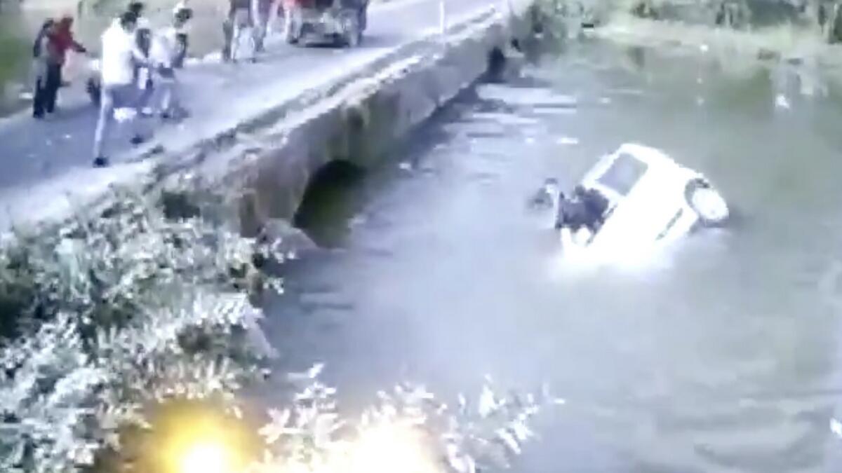 indian, sinking car, man throws baby, in air, india, Madhya Pradesh