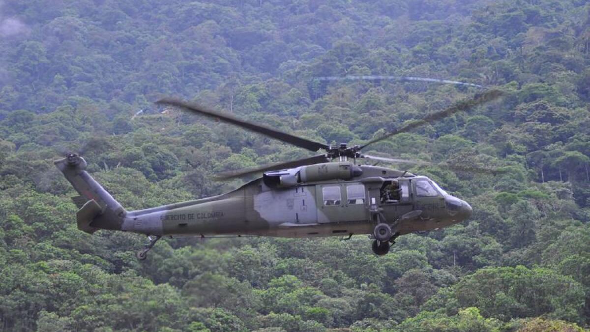 Colombian, army, recovered, two. bodies, helicopter, crash