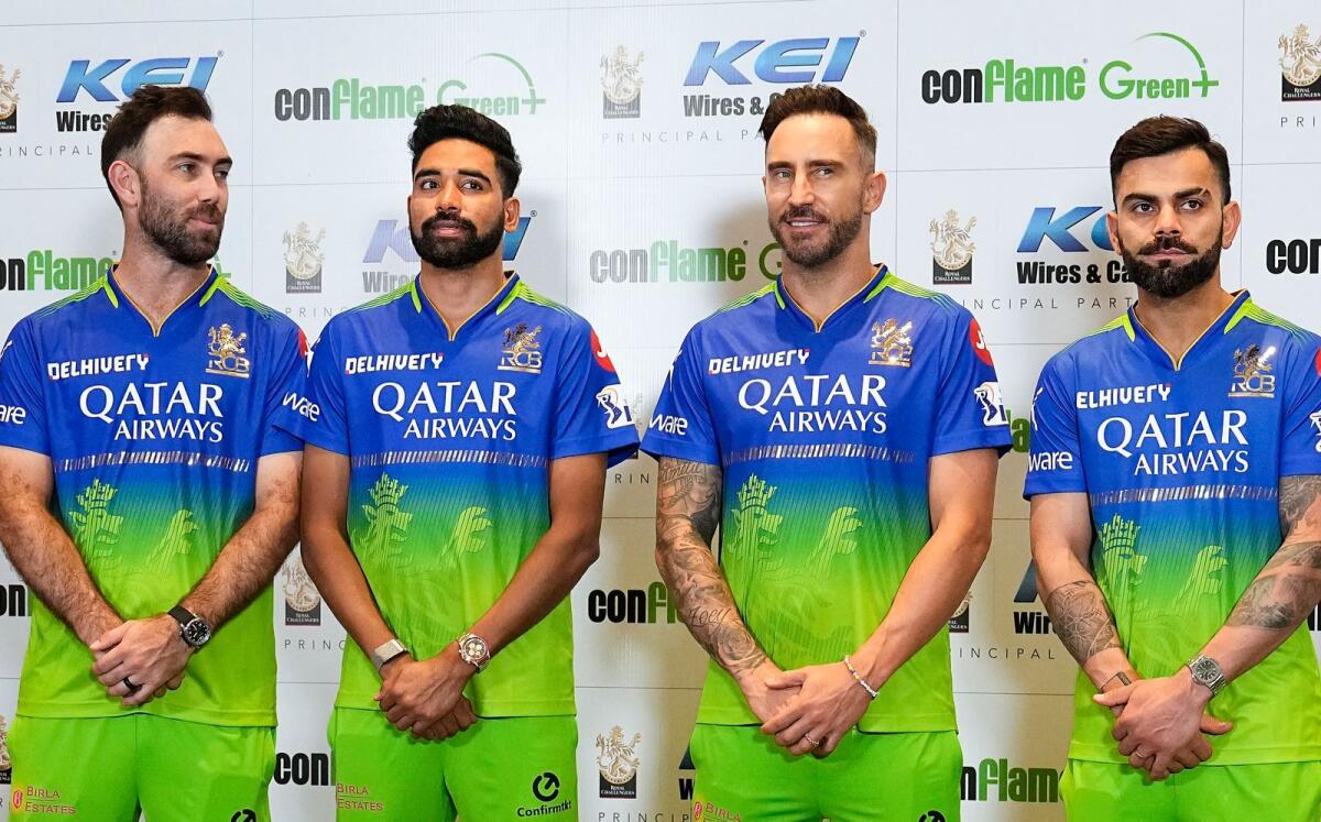 Royal Challengers Bangalore's captain Faf du Plessis with teammates Virat Kohli, Mohammed Siraj and Glenn Maxwell during the launch of the team's green jersey for the Indian Premier League (IPL) 2024. - PTI