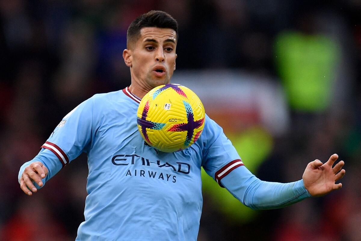 Manchester City's Portuguese defender Joao Cancelo controlling the ball during the English Premier League match against Manchester United. — AFP file