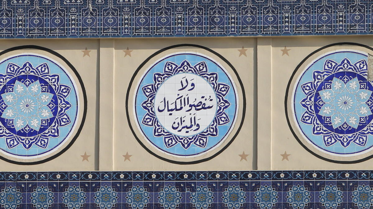 TILING A STORY... The blue ceramic tilework gives the souq its distinctive design and character.