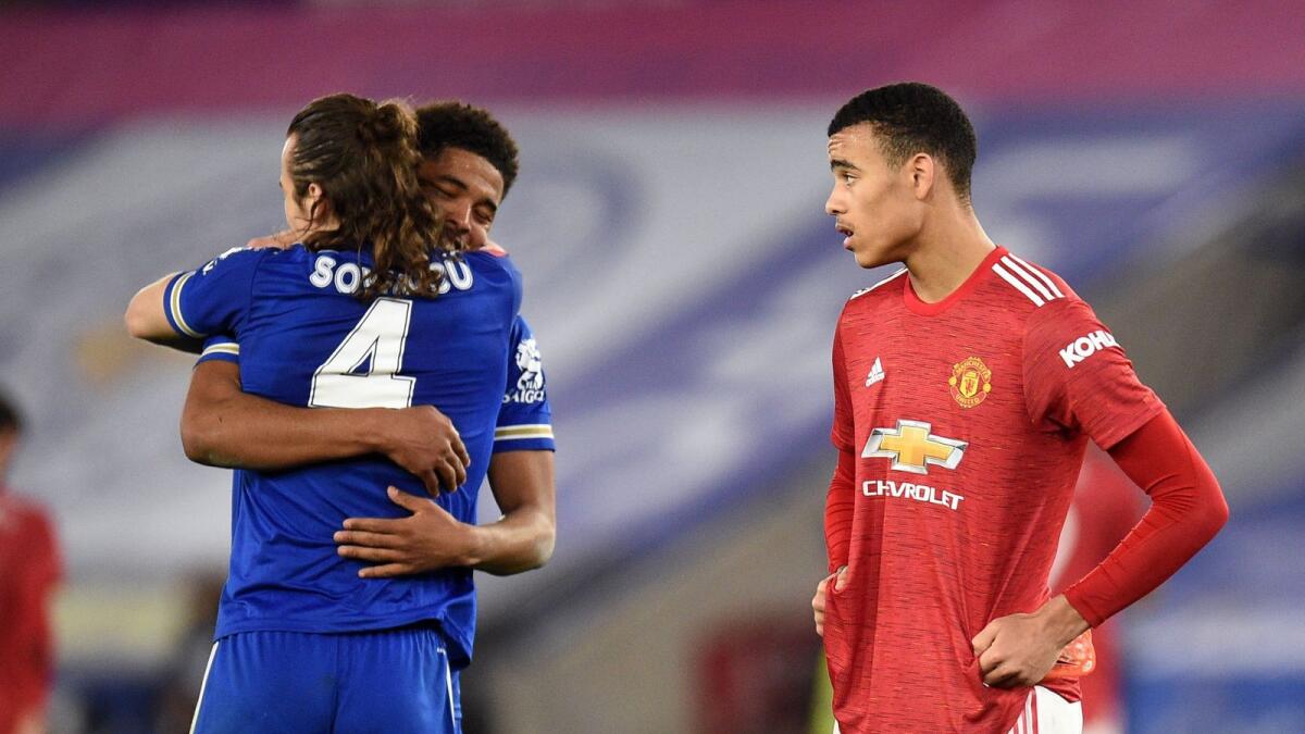 Manchester United's Mason Greenwood looks dejected as Leicester City's Caglar Soyuncu and Wesley Fofana celebrate after their FA Cup victory. — Reuters
