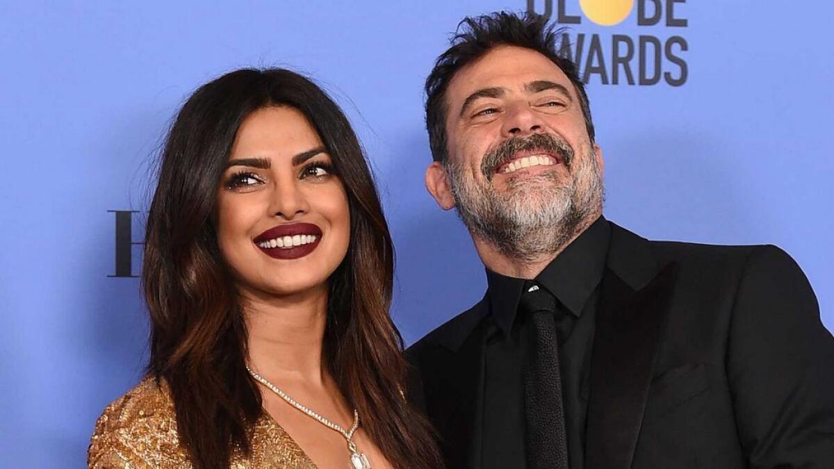 Priyanka Chopra, left, and Jeffrey Dean Morgan pose in the press room at the 74th annual Golden Globe Awards at the Beverly Hilton Hotel on Sunday, Jan. 8, 2017, in Beverly Hills, Calif. (AP)