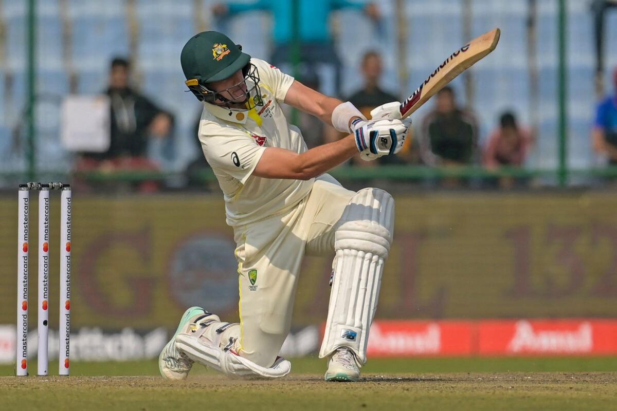 Australia's captain Pat Cummins plays a shot during the first day of the second Test at the Arun Jaitley Stadium in New Delhi on Sunday. — AFP