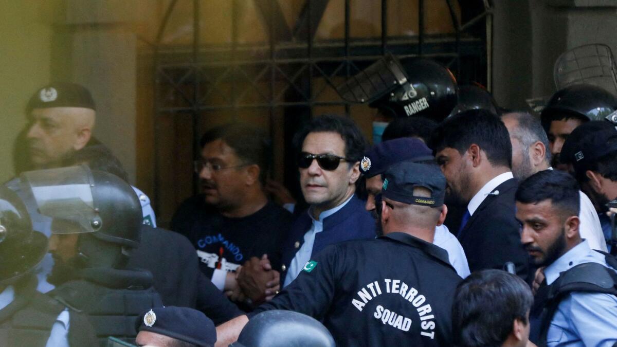 Security officers escort Pakistan's former Prime Minister Imran Khan, as he appeared in Islamabad High Court, Islamabad, Pakistan May 12, 2023. (Photo: Reuters file)