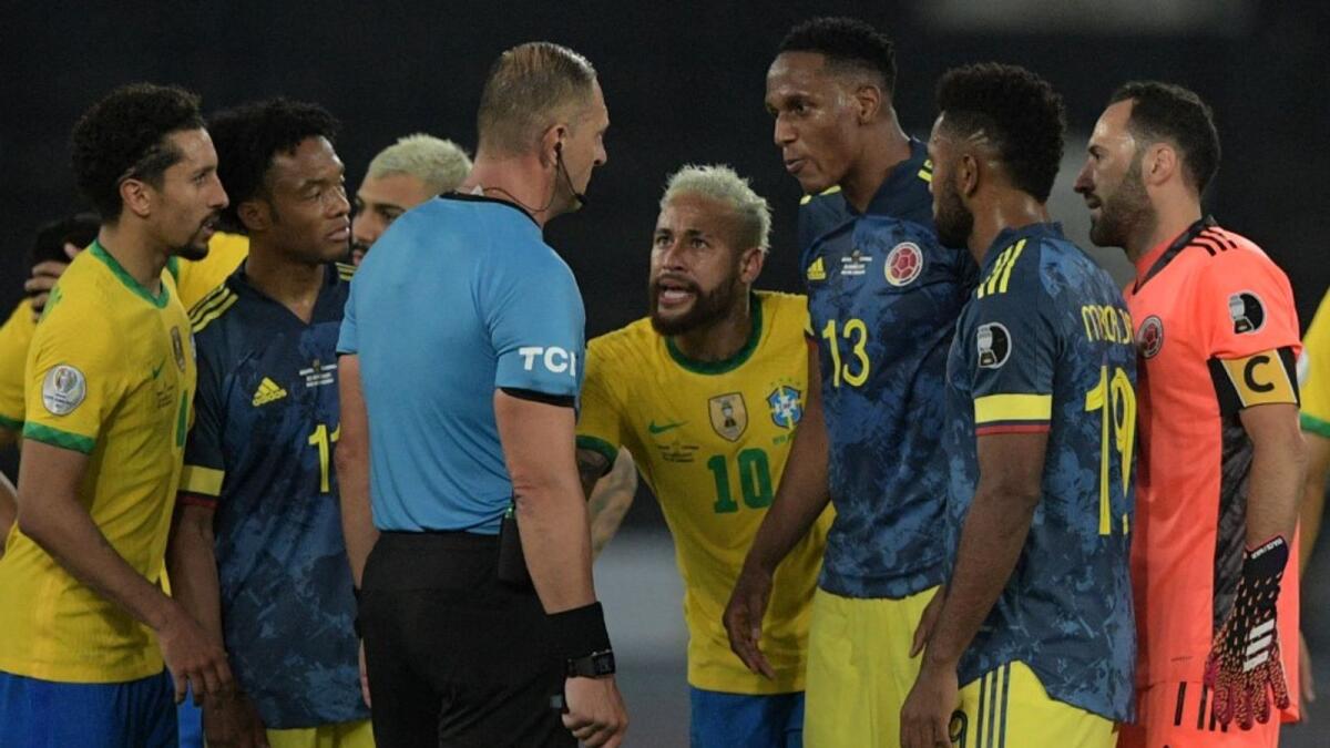 Brazil's Neymar and Colombian players argue with the referee during the controversial Copa America match. (AFP)