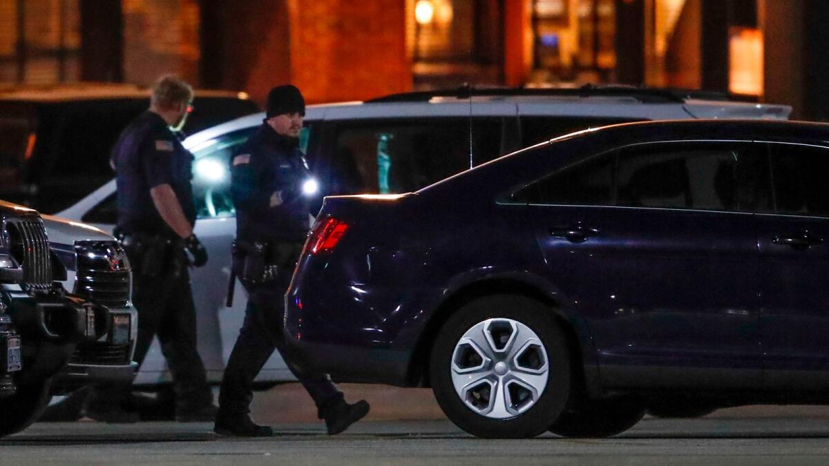 Police officers investigate the area outside the Mayfair Mall in Wauwatosa, Wisconsin, on November 20, 2020. AFP