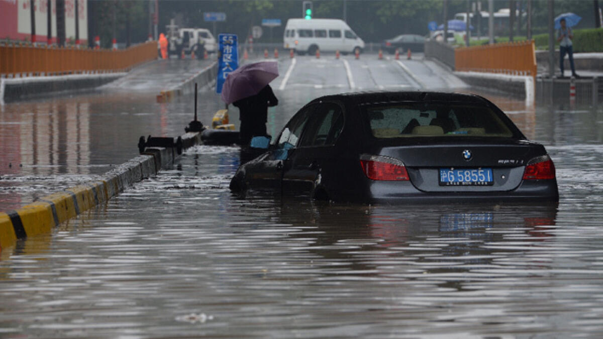 Heavy rains in southern China kill 18, leave 4 missing