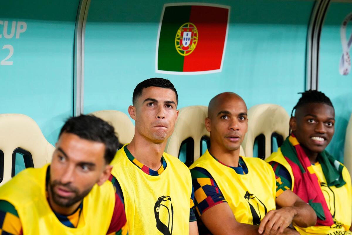 Portugal's Cristiano Ronaldo, middle left, sits on the bench before the World Cup round of 16 match. Photo: AP