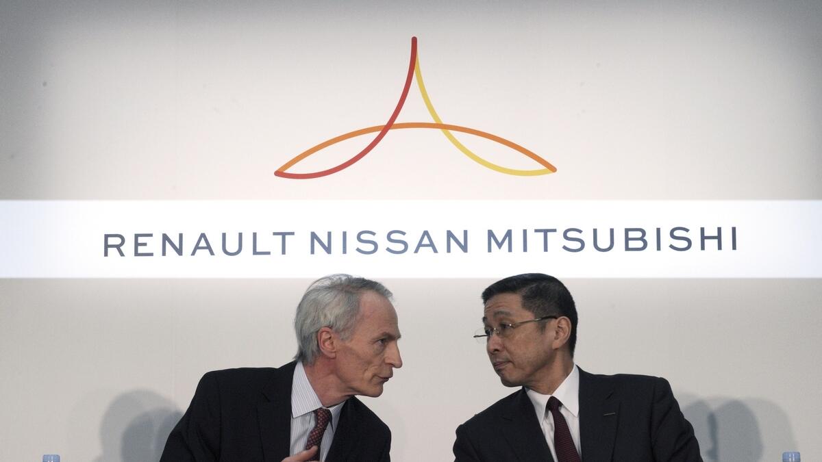 Renault Chairman Jean-Dominique Senard, left, and Nissan CEO Hiroto Saikawa speak at the start of a joint press conference following a board meeting at the Nissan headquarters in Yokohama, near Tokyo.-AP 