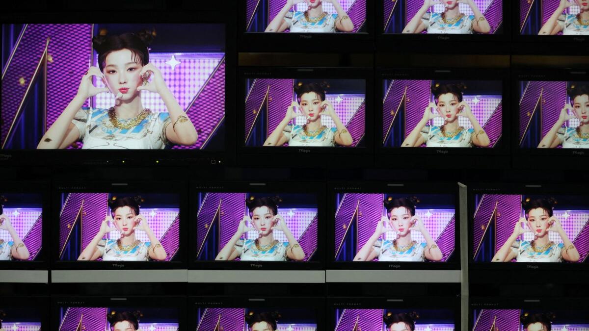 Footages of virtual girl group MAVE is played at the control room of MBC in Seoul, South Korea (Photo: Reuters)