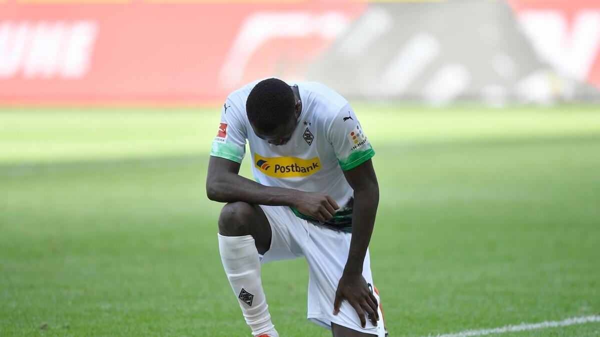 Moenchengladbach's French forward Marcus Thuram joined an array of sporting personalities in protesting racism in the United States when he took a knee after scoring for Borussia Moenchengladbach in the Bundesliga on Sunday.(AFP)