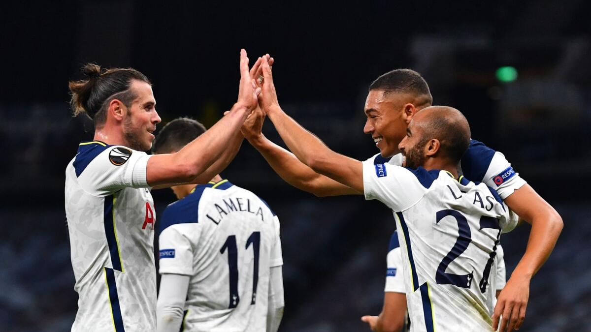 Tottenham Hotspur's Lucas Moura (R) celebrates scoring their first goal with Carlos Vinicius and Gareth Bale (L).