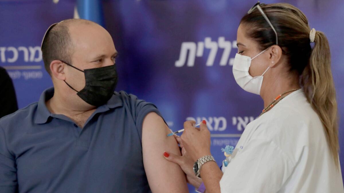 Israel's Prime Minister Naftali Bennett receives a booster shot for the coronavirus vaccine in the Meir Medical Center in Kfar Saba. — AP