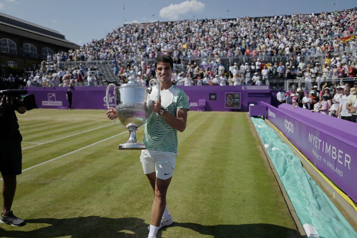 Carlos Alcaraz won his his first grass-court title at Queens Club in London, England. - AP