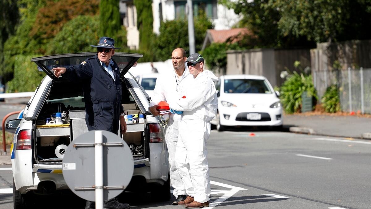 Forensic experts collect evidence near one of the attacked mosques in Christchurch.-AFP 