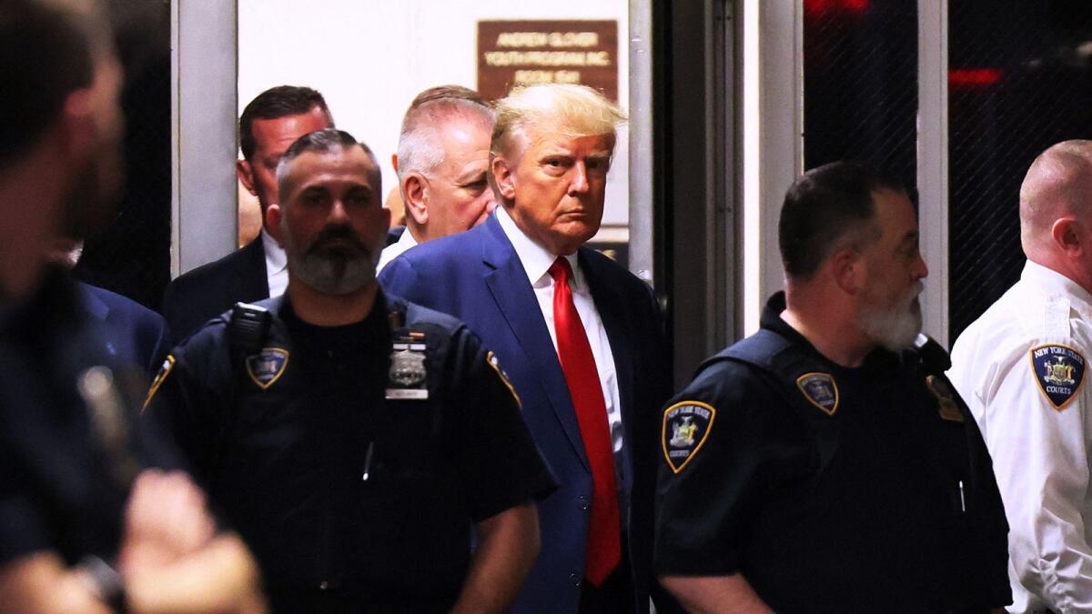 Former US president Donald Trump arrives for his arraignment at Manhattan Criminal Court on April 04, 2023 in New York City. --- AFP
