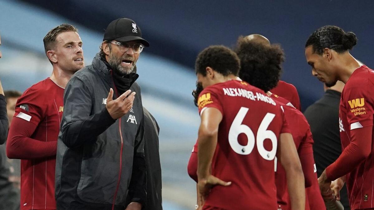 Liverpool manager Juergen Klopp talks to Trent Alexander-Arnold during a drinks break during the match against Manchester City. - Reuters