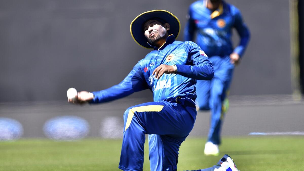 Sri Lanka’s Tillakaratne Dilshan  takes the catch of New Zealand’s Martin Guptill. 