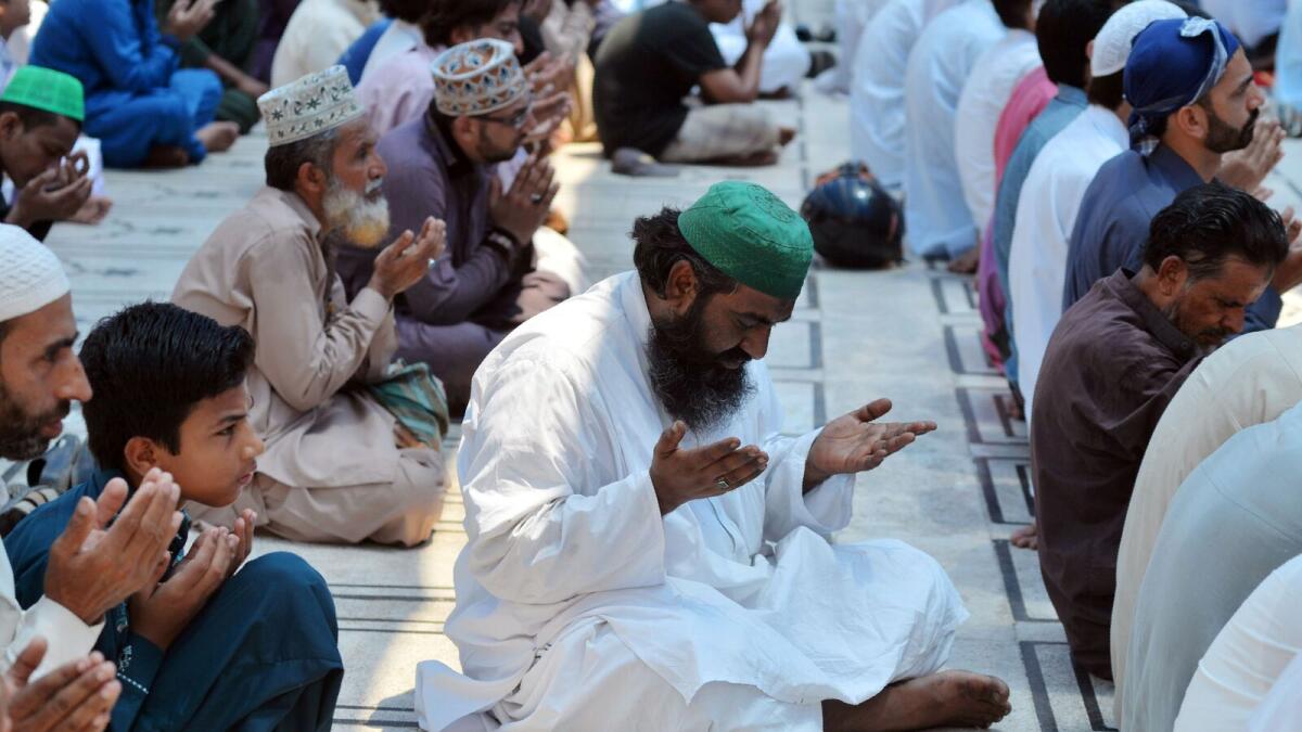 Muslims offer prayers during the last Friday prayers in the holy month of Ramadan, ahead of Eid Al Fitr, at a mosque in Karachi on June 23, 2017.