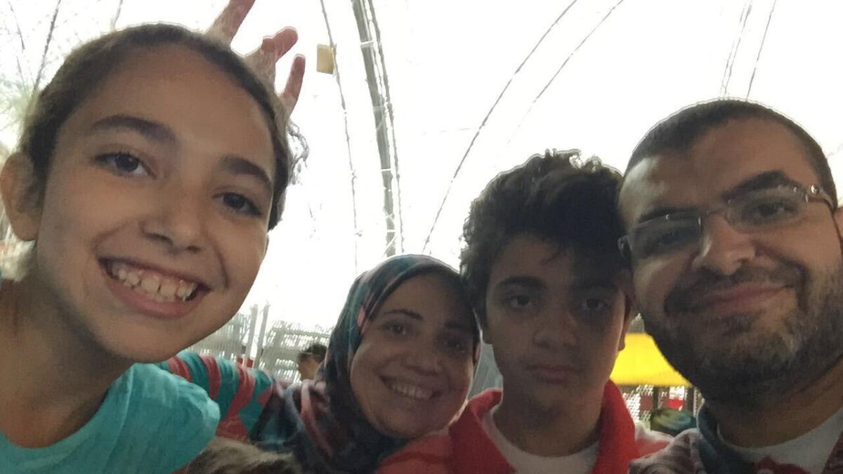 13-year-old Dubai Autism Centre student, Ahmed Hegazy with his mother Eman Younis, father and sister. He was one of the first students to start using BabNoor app.— Supplied photos