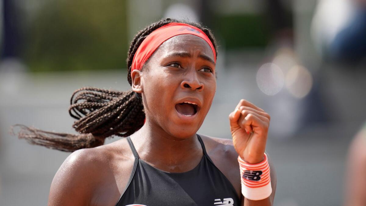 Coco Gauff celebrates after winning a point against China's Qiang Wang. — AP