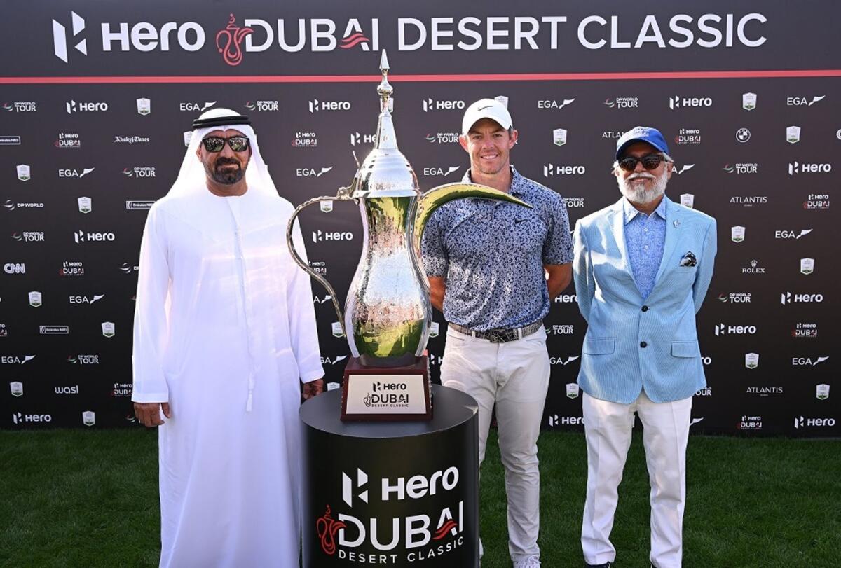 Sheikh Ahmed bin Saeed Al Maktoum, Chairman and CEO of Emirates Airline &amp; Group, Rory McIlroy of Northern Ireland and Dr Pawan Munjal, CEO of the Hero MotoCorp pose with the Hero Dubai Desert Classic trophy during the 2023 edition of the tournament  at Emirates Golf Club. Photo by Ross Kinnaird/Getty Images