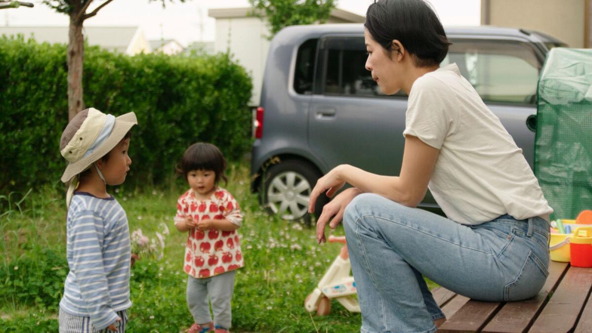 This photo provided by Japan Media Services shows a scene from The Ones Left Behind: The Plight of Single Mothers in Japan, directed by Rionne McAvoy. — AP
