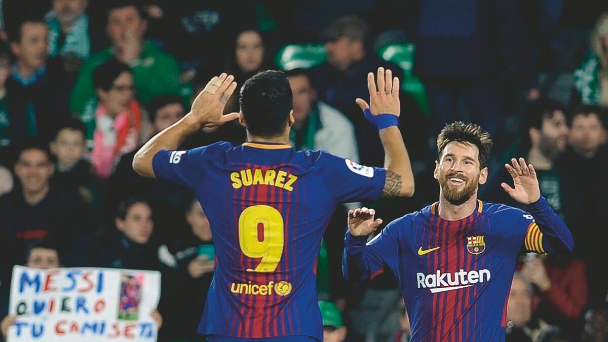 Messi and Suarez power Barcas 5-0 romp of Betis