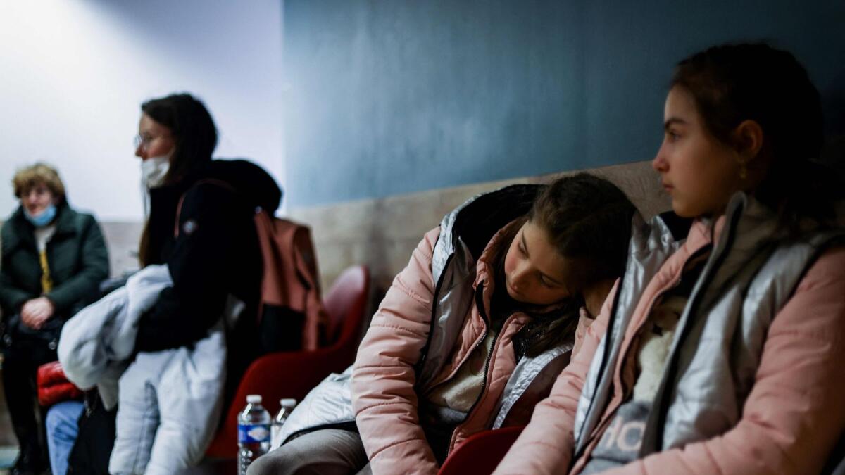 Ukrainian refugees wait for an appointment in a centre for the registration and shelter set at the former Jules Bordet Hospital in Brussels, on March 8, 2022. —AFP 