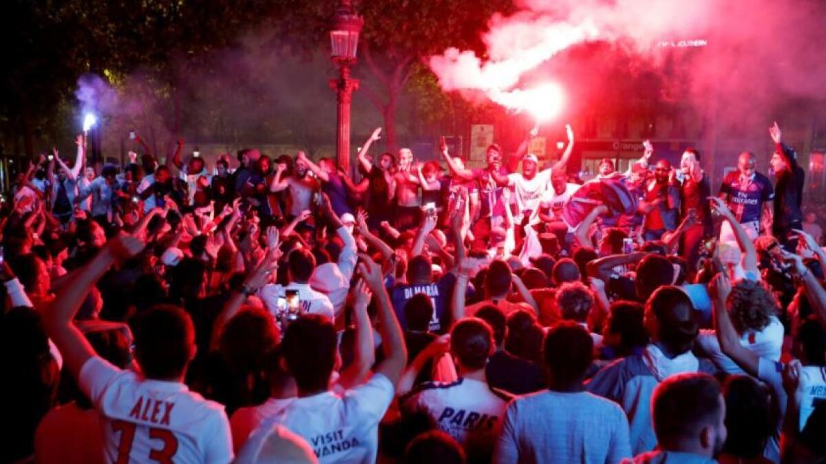 Paris St Germain fans celebrate on the Champs-Elysees after the match. (Reuters)