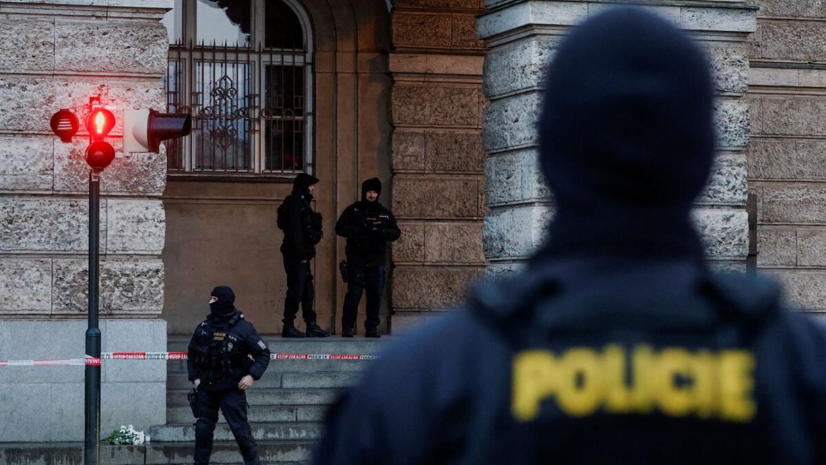Members of the Police stand guard following a shooting at one of Charles University's buildings in Prague, Czech Republic. — Photo: Reuters