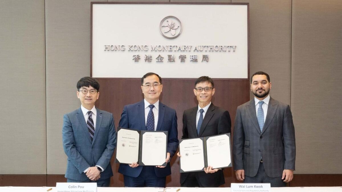 (From left) The Memorandum of Understanding signing ceremony is attended by Nelson Chow, Head (Financial Market Infrastructure Service) of the HKMA; Colin Pou; Mr Wai Lum Kwok; and Shaikh Saoud Al Mualla, Consul-General of the UAE in the Hong Kong Special Administrative Region.