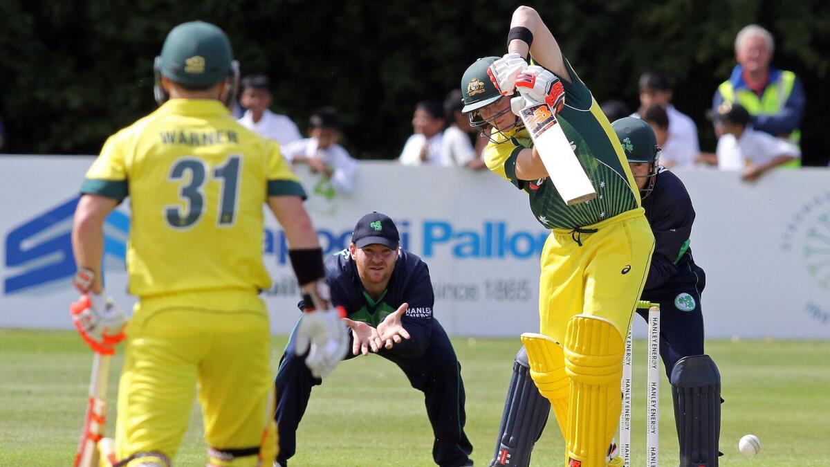 Australias captain Steve Smith (2R) bats during the one day international (ODI) cricket match between Ireland and Australia at Stormont Cricket Club in Belfast.