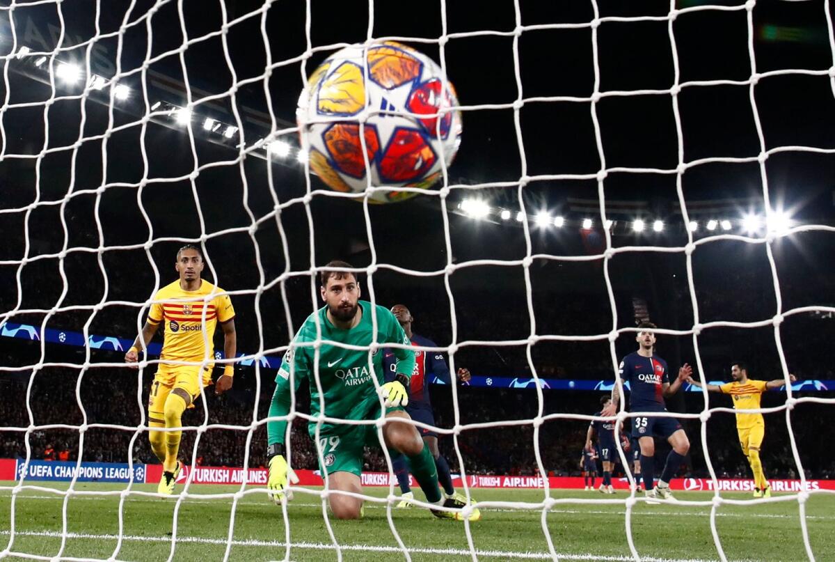 FC Barcelona's Raphinha scores their second goal past Paris St Germain's Gianluigi Donnarumma. - Reuters