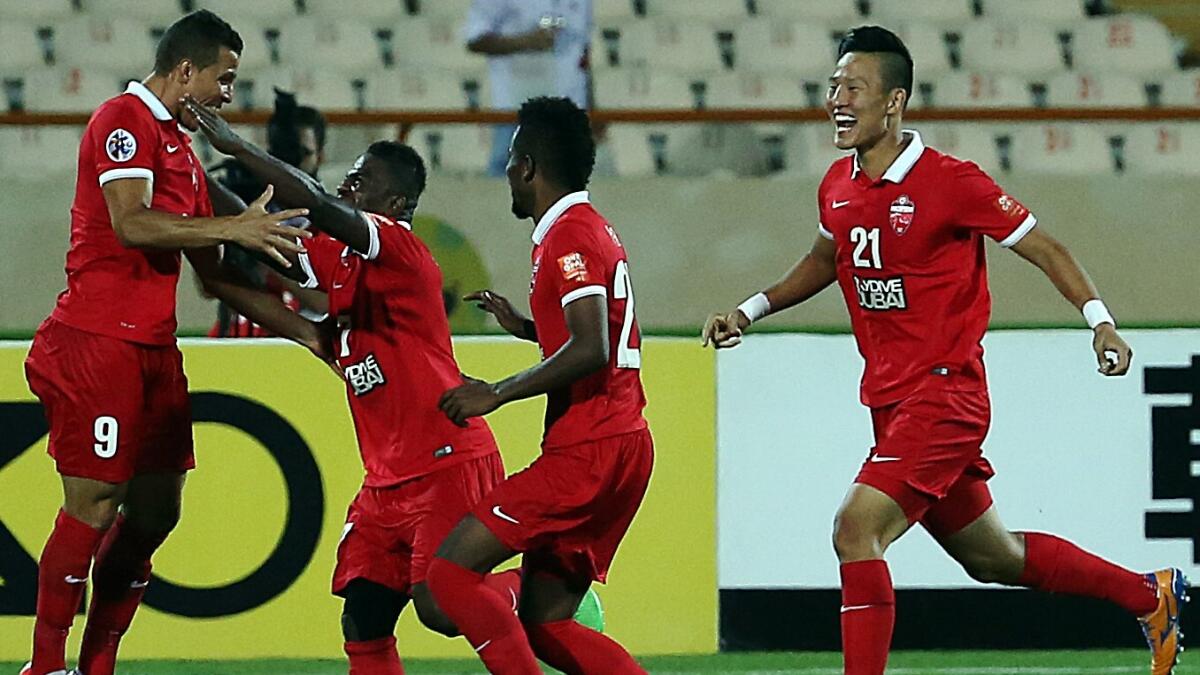 Al Ahli’s Lima (left) celebrates after scoring a goal against Naft Tehran FC on Wednesday. 