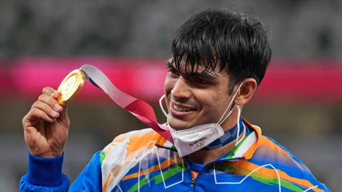India's Neeraj Chopra celebrates with the gold medal at the 2020 Summer Olympics. — AP
