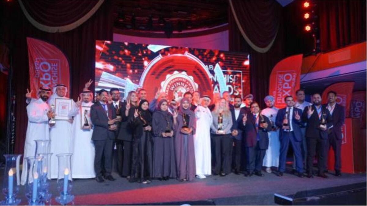 Dr Eesa Mohammed Bastaki, President of the University of Dubai with the winners of  Arab Franchise Awards 2023 Ceremony in Dubai. — Supplied photo