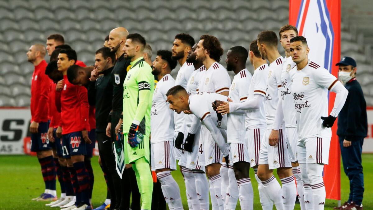 Lille and Bordeaux players line up before the match. — Reuters