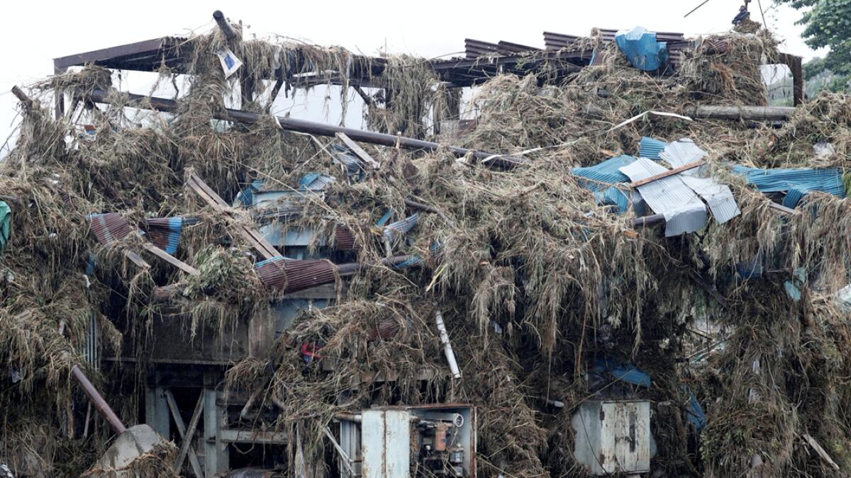 A damaged building is covered in debris, at a stone quarry, after floods caused by torrential rain swept through Kumamura, Kumamoto Prefecture, southwestern Japan. Photo: Reuters